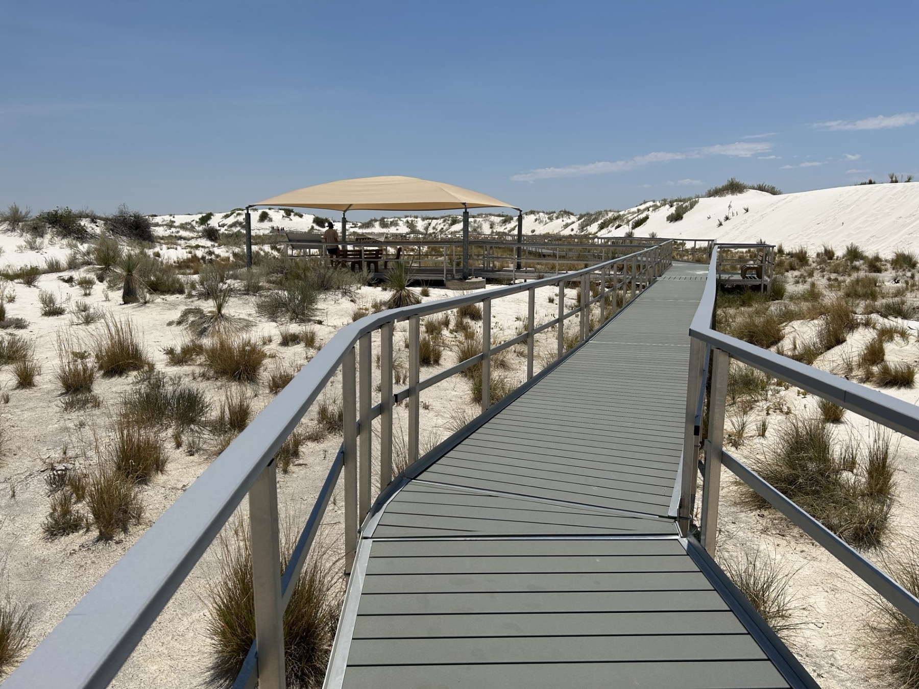 Level Interdune Boardwalk with railings winding through the white gypsum dunes