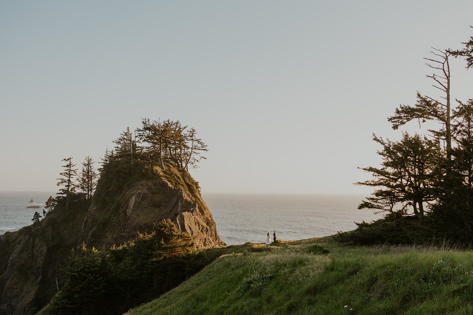 Couple talking on the Oregon Coast by Venturing Vows